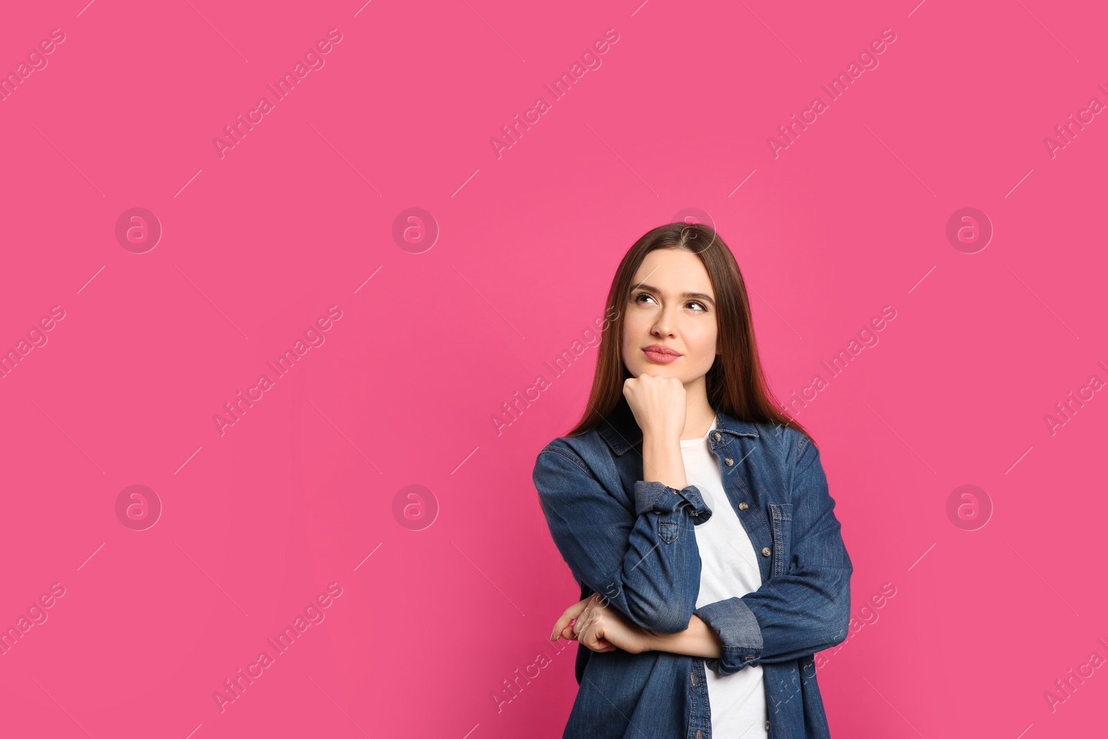 Photo of Pensive woman on pink background, space for text. Thinking about answer to question