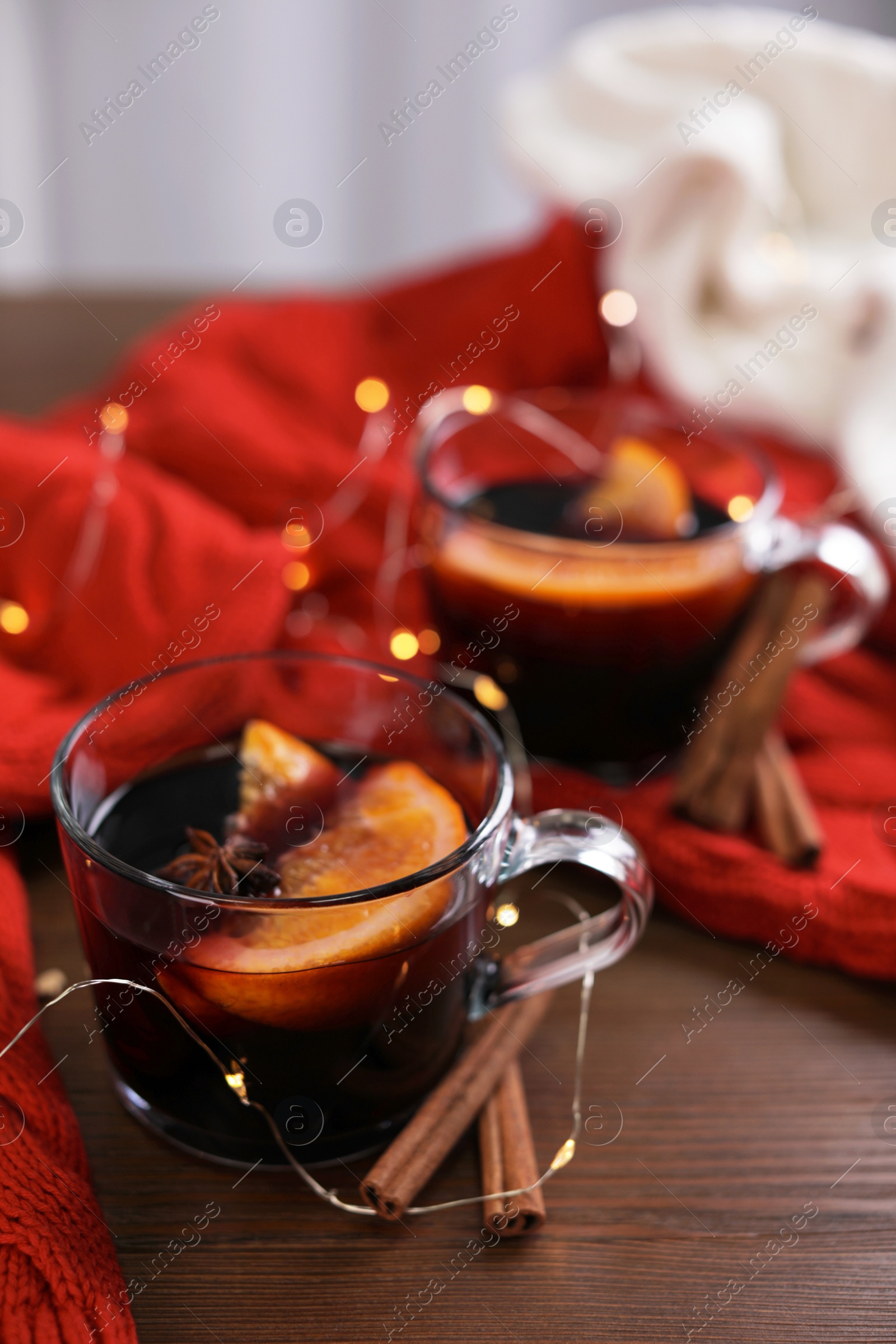 Photo of Beautiful composition with cup of mulled wine on table. Space for text
