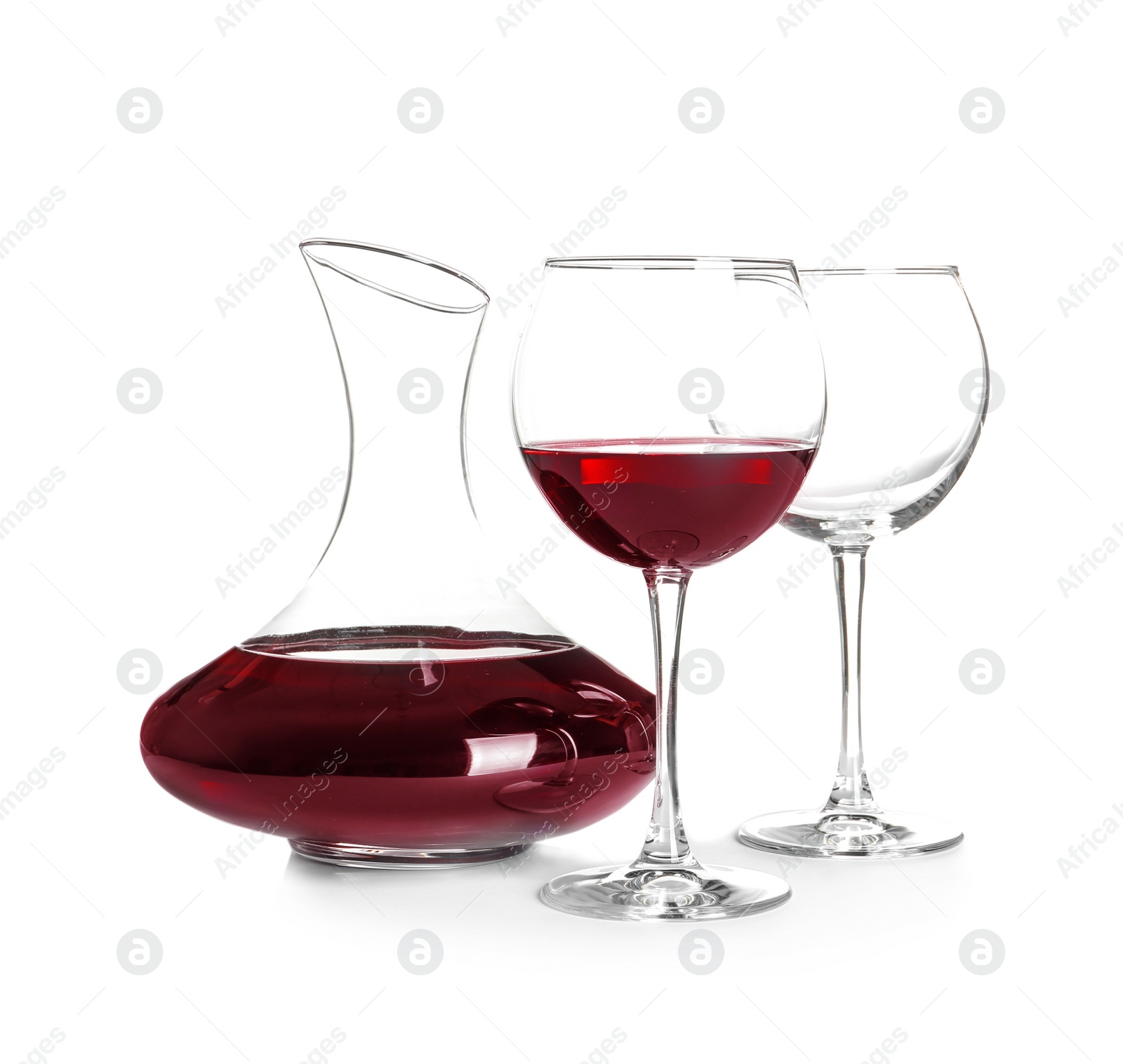 Photo of Elegant decanter with red wine and glasses on white background