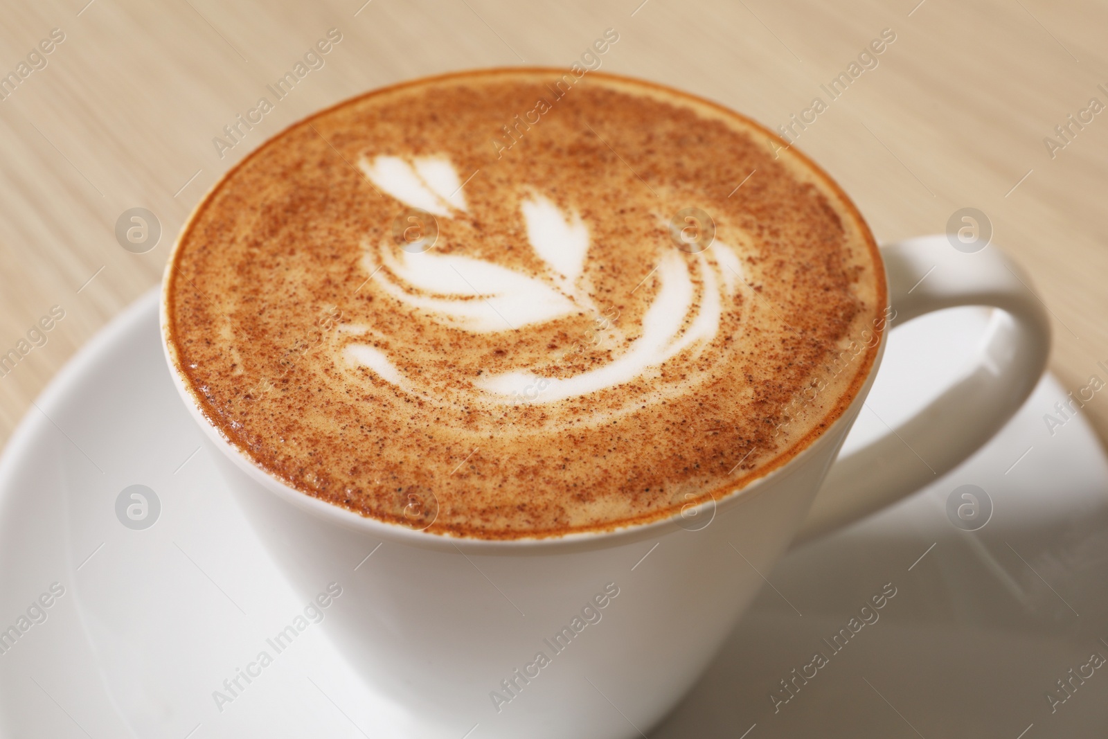 Photo of Cup of aromatic coffee on table, closeup