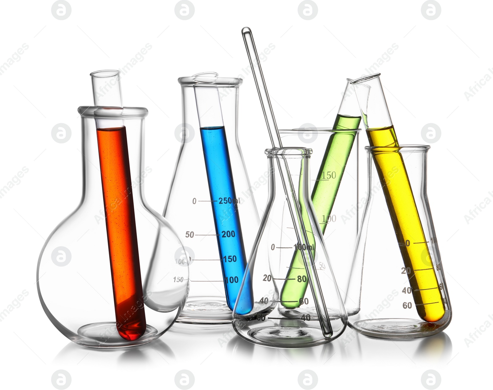 Photo of Glass flasks, beaker and test tubes with colorful liquids isolated on white