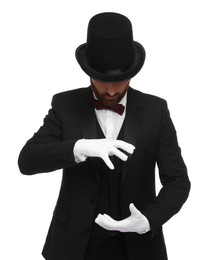 Photo of Magician in top hat holding something on white background
