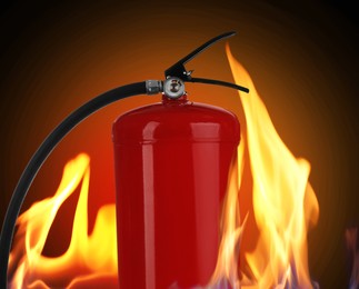 Fire extinguisher surrounded by flame on dark background