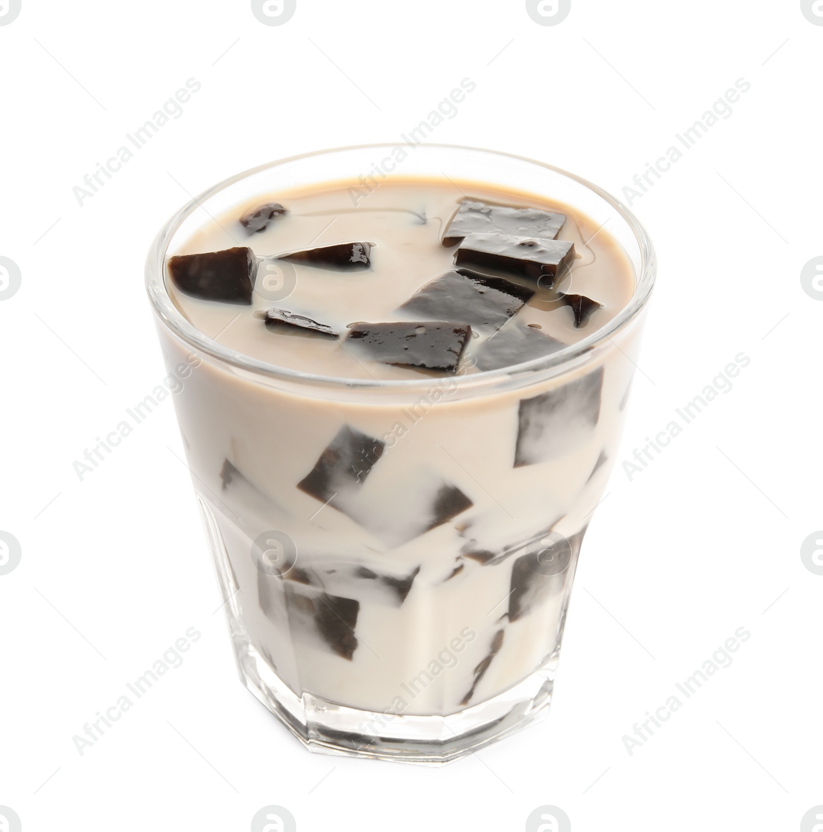 Photo of Glass of milk with grass jelly isolated on white