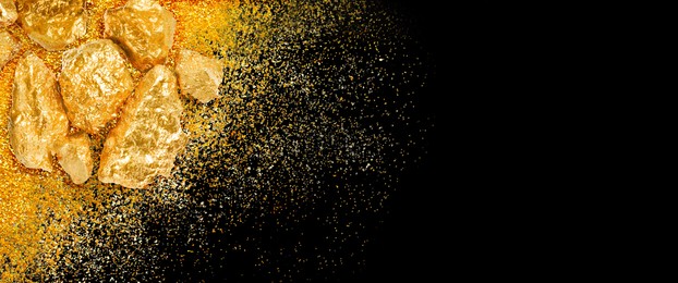 Image of Gold nuggets and gold dust on black background, top view. Banner design with space for text