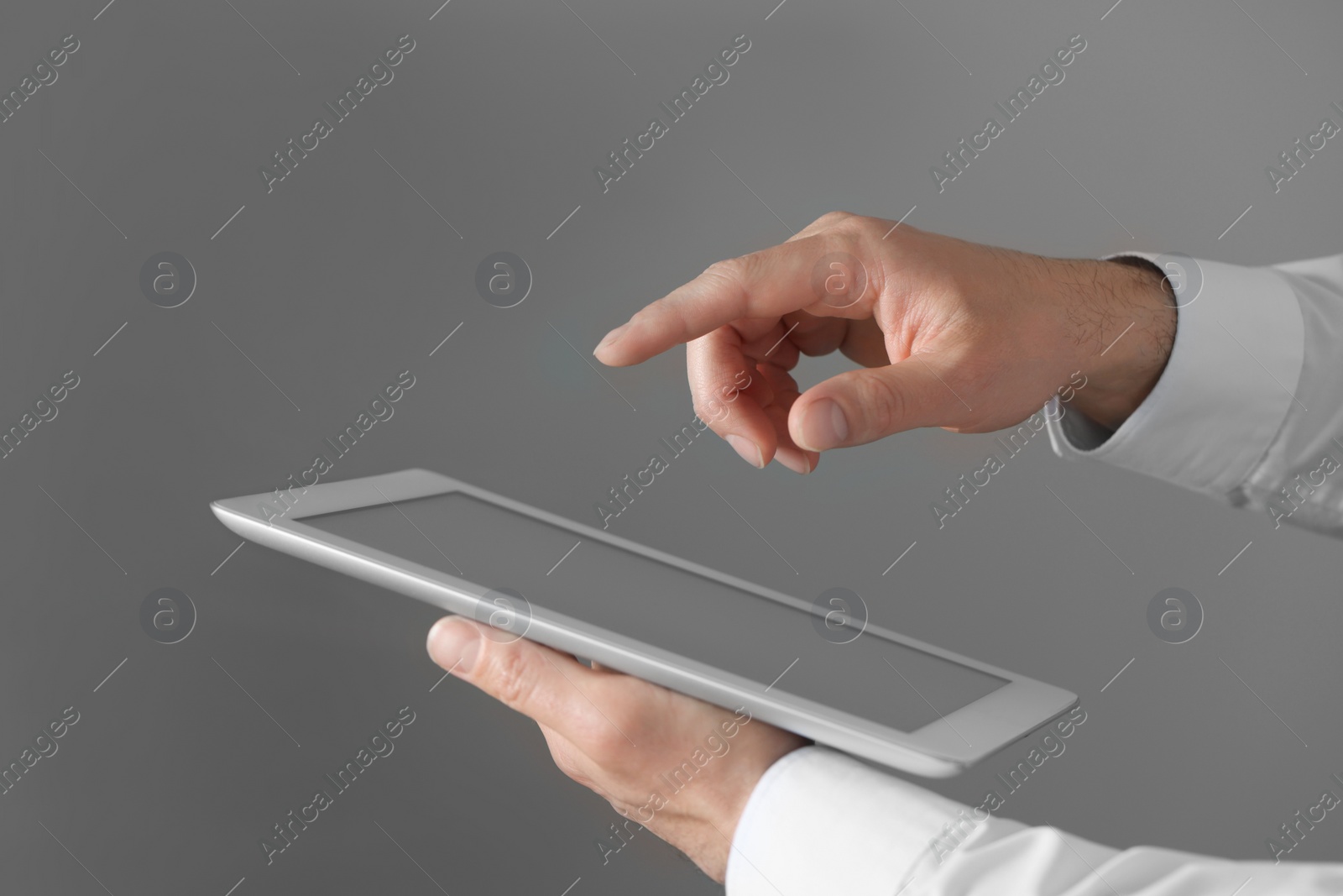 Photo of Closeup view of man using new tablet indoors