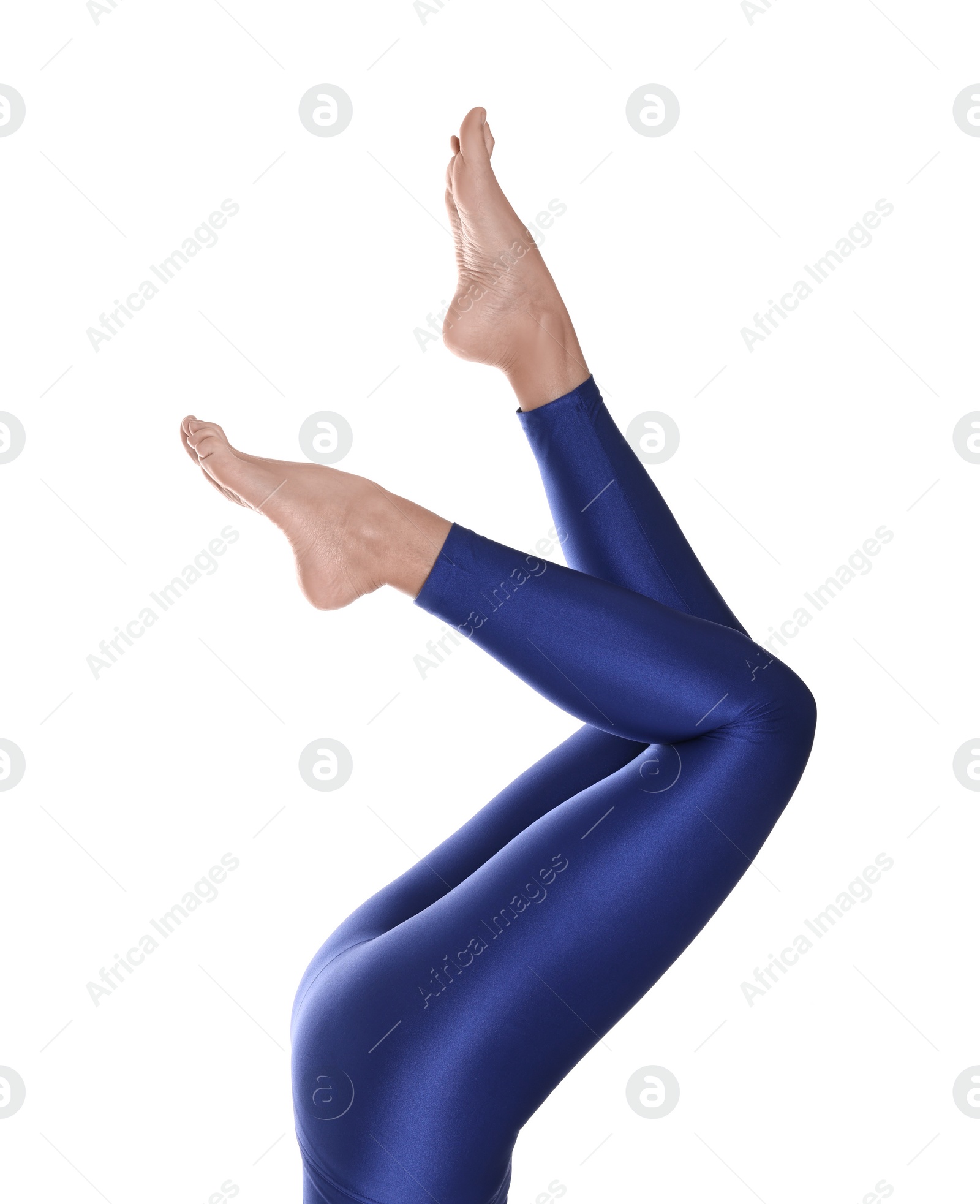 Photo of Woman with beautiful long legs wearing blue leggings on white background, closeup