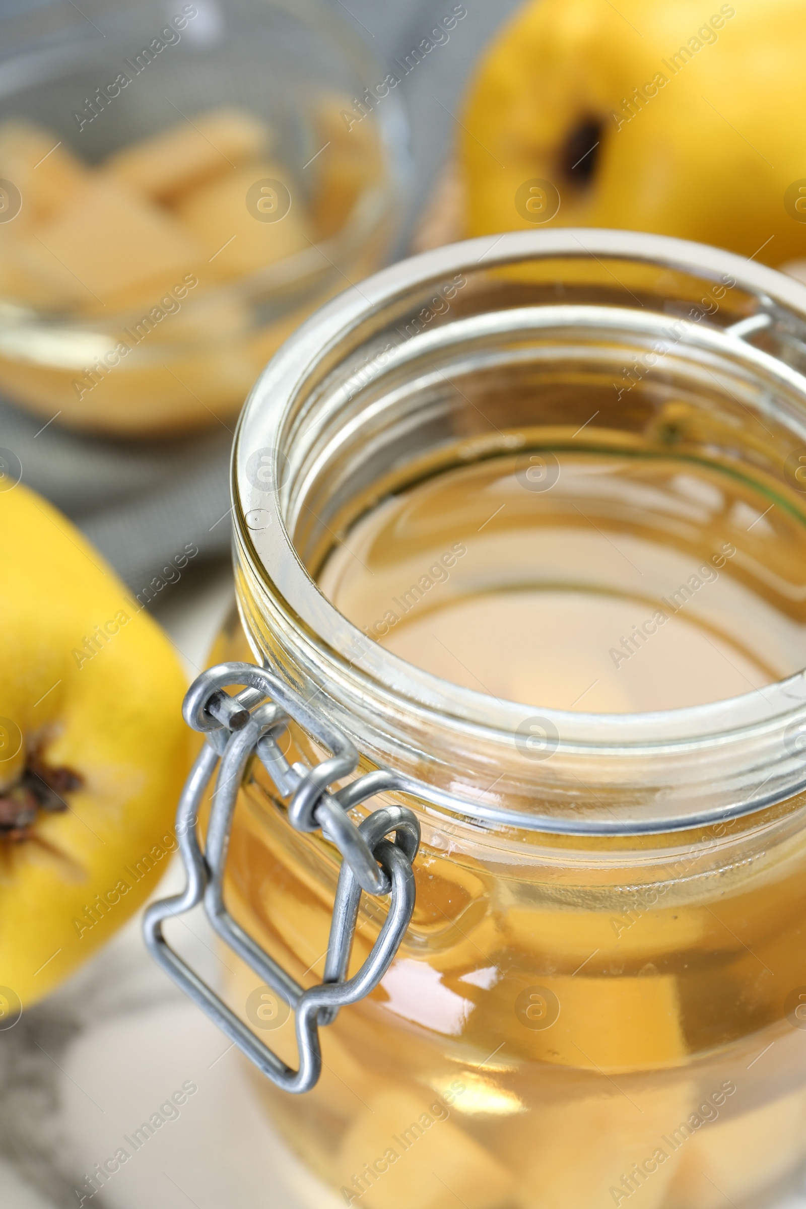 Photo of Delicious quince drink in jar, closeup view