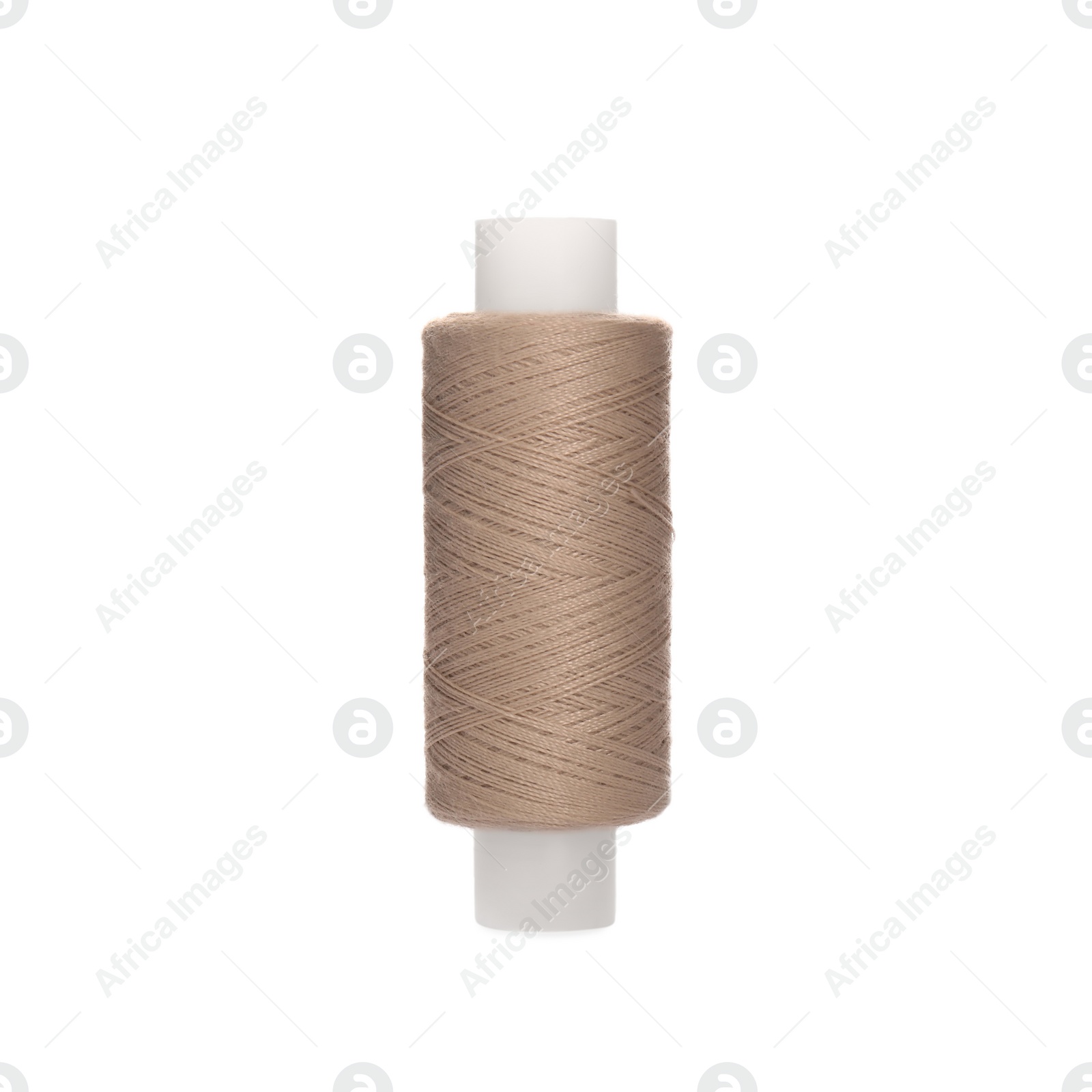 Photo of Spool of beige sewing thread isolated on white