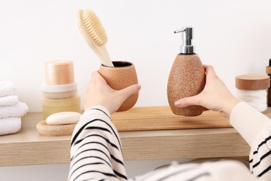 Photo of Bath accessories. Woman with different personal care products indoors, closeup