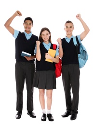 Photo of Full length portrait of teenagers in school uniform on white background
