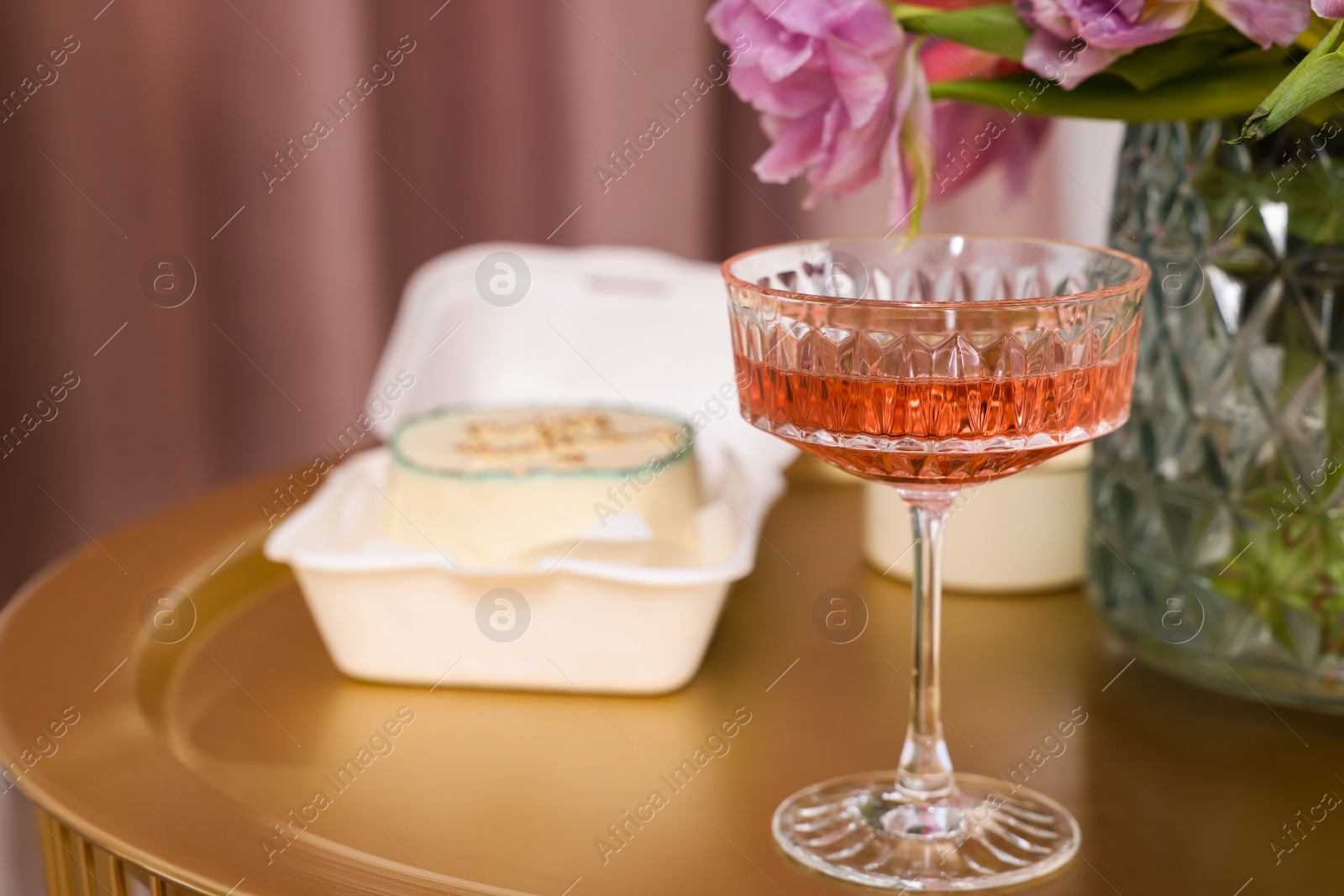 Photo of Glass of delicious wine on table indoors, closeup. Space for text
