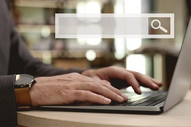 Search bar of website over laptop. Man using computer at wooden table, closeup
