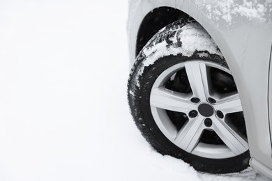 Photo of Car with winter tires on snowy road, space for text