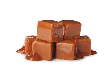 Photo of Caramel candies with topping on white background