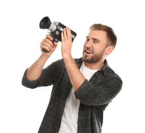 Photo of Young man with vintage video camera on white background
