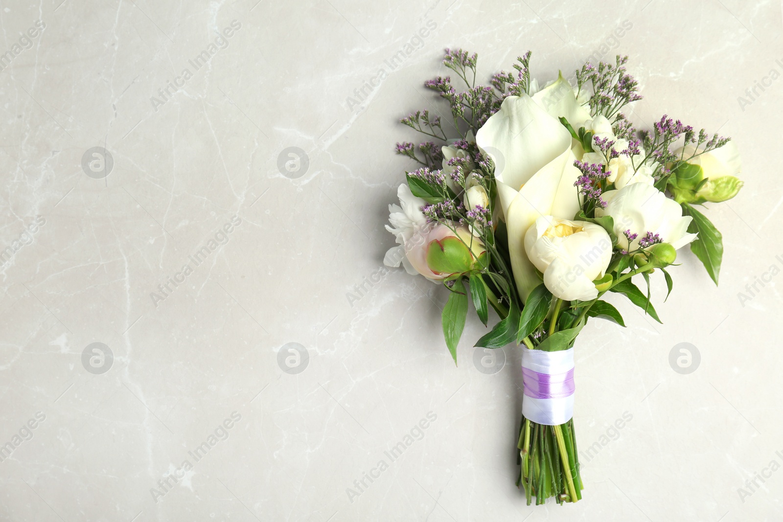 Photo of Bouquet of beautiful fragrant flowers on table