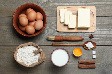 Photo of Cooking utensils and ingredients on wooden table, flat lay