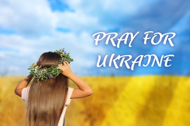Image of Pray for Ukraine. Double exposure of girl wearing flower wreath outdoors and Ukrainian flag