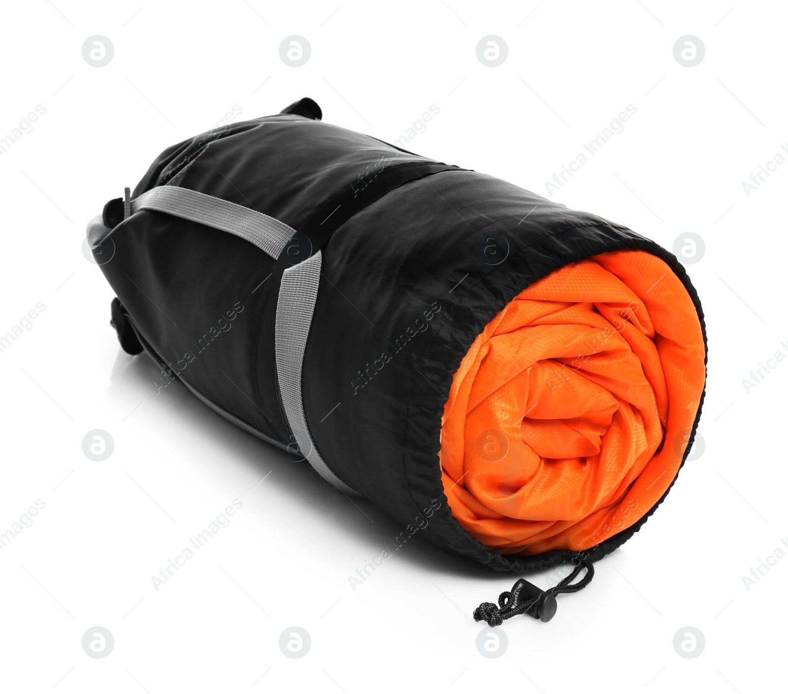 Photo of Sleeping bag in case on white background. Camping equipment