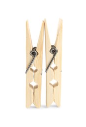 Photo of Two classic wooden clothespins on white background