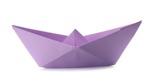 Photo of Handmade violet paper boat isolated on white. Origami art