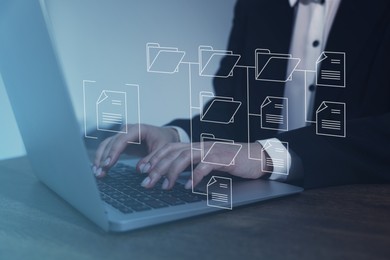 Image of Electronic document management. Woman working on laptop at table, closeup