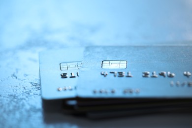 Photo of Plastic credit cards on table, closeup view