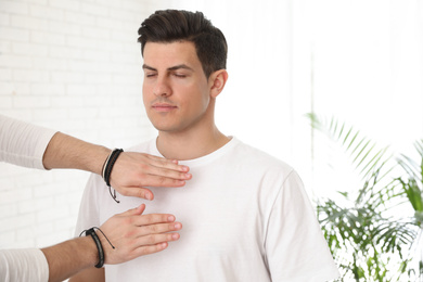 Photo of Man during healing session in therapy room