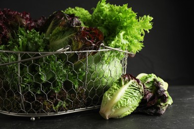 Photo of Different sorts of lettuce on black slate table