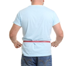 Photo of Overweight man with measuring tape on white background