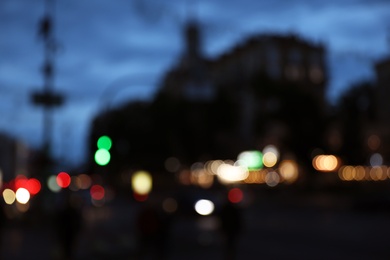 Photo of Blurred view of modern city at evening. Bokeh effect