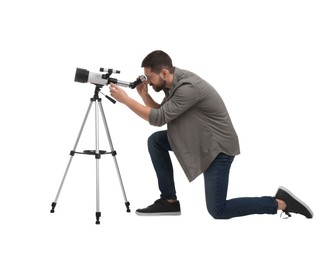 Photo of Astronomer looking at stars through telescope on white background
