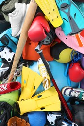 Photo of Many different sports equipment as background, top view