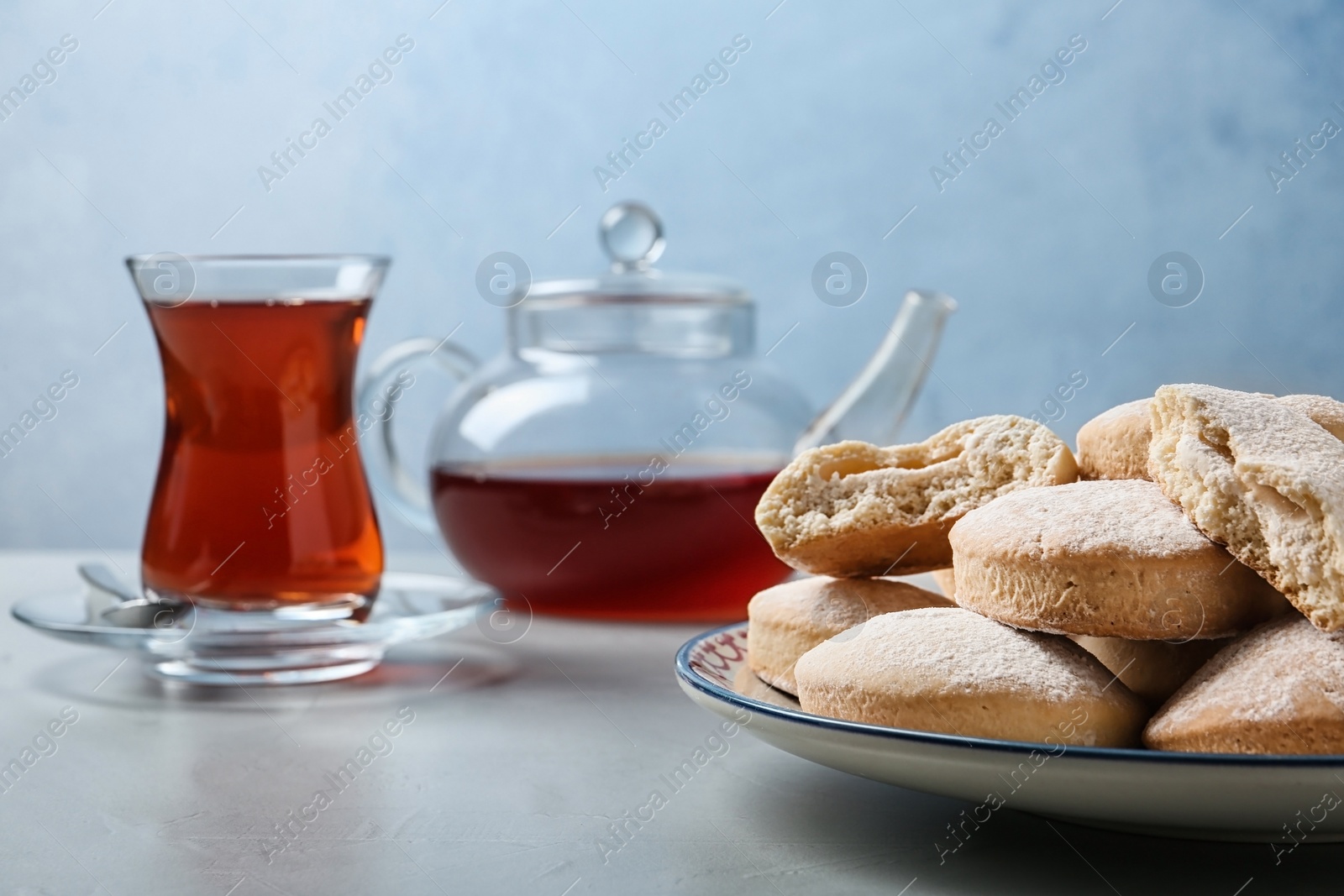 Photo of Plate of traditional cookies for Islamic holidays on table, space for text. Eid Mubarak