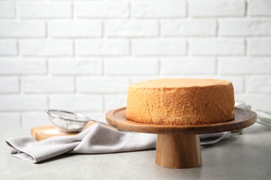 Photo of Delicious fresh homemade cake on light grey marble table