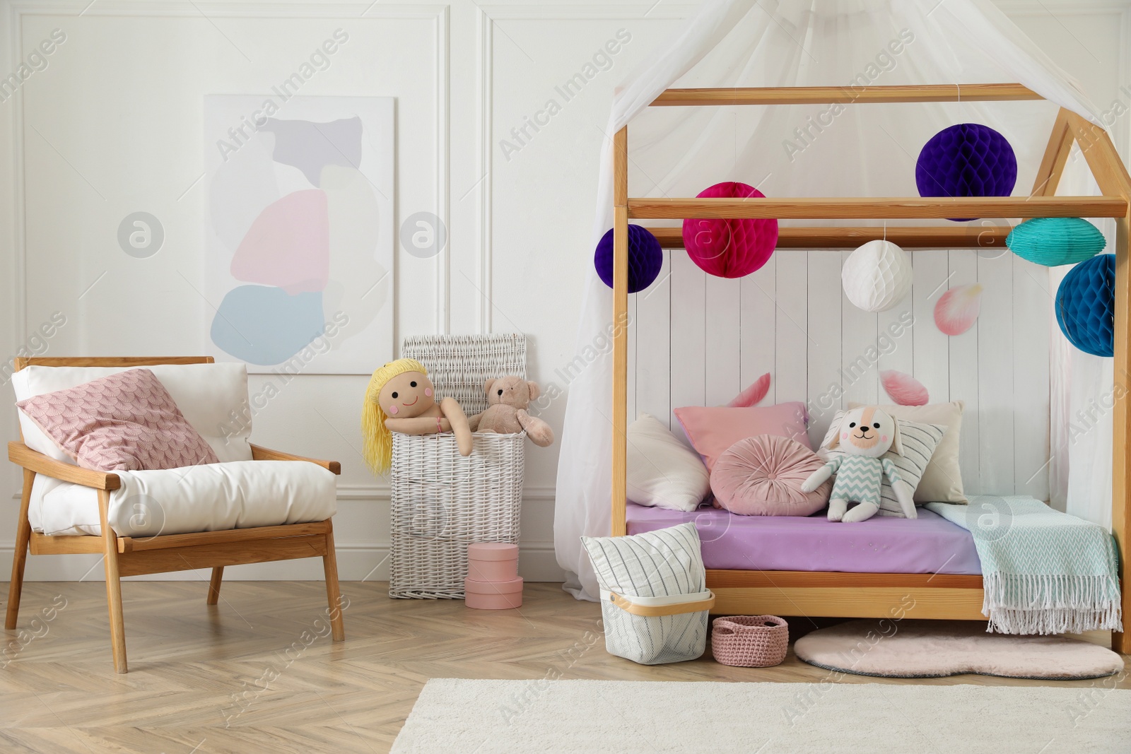 Photo of Stylish room for kid with house bed. Interior design