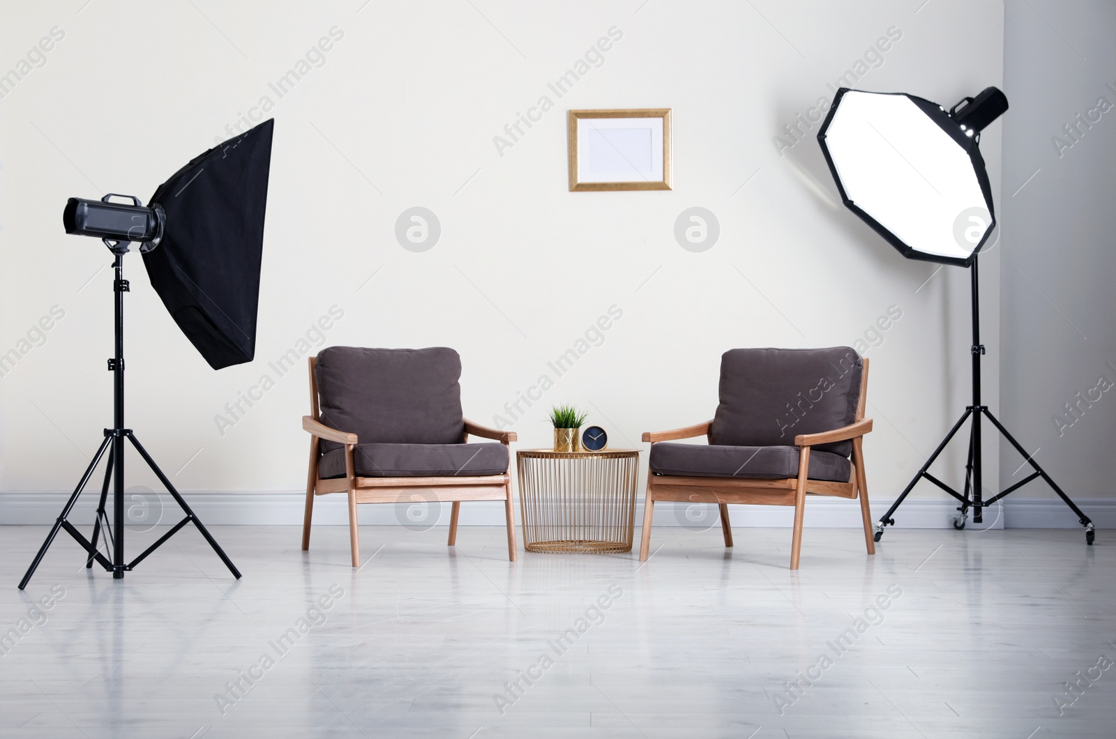 Photo of Professional photo studio equipment prepared for shooting living room interior