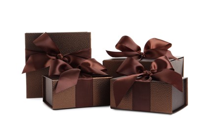 Many beautiful brown gift boxes on white background