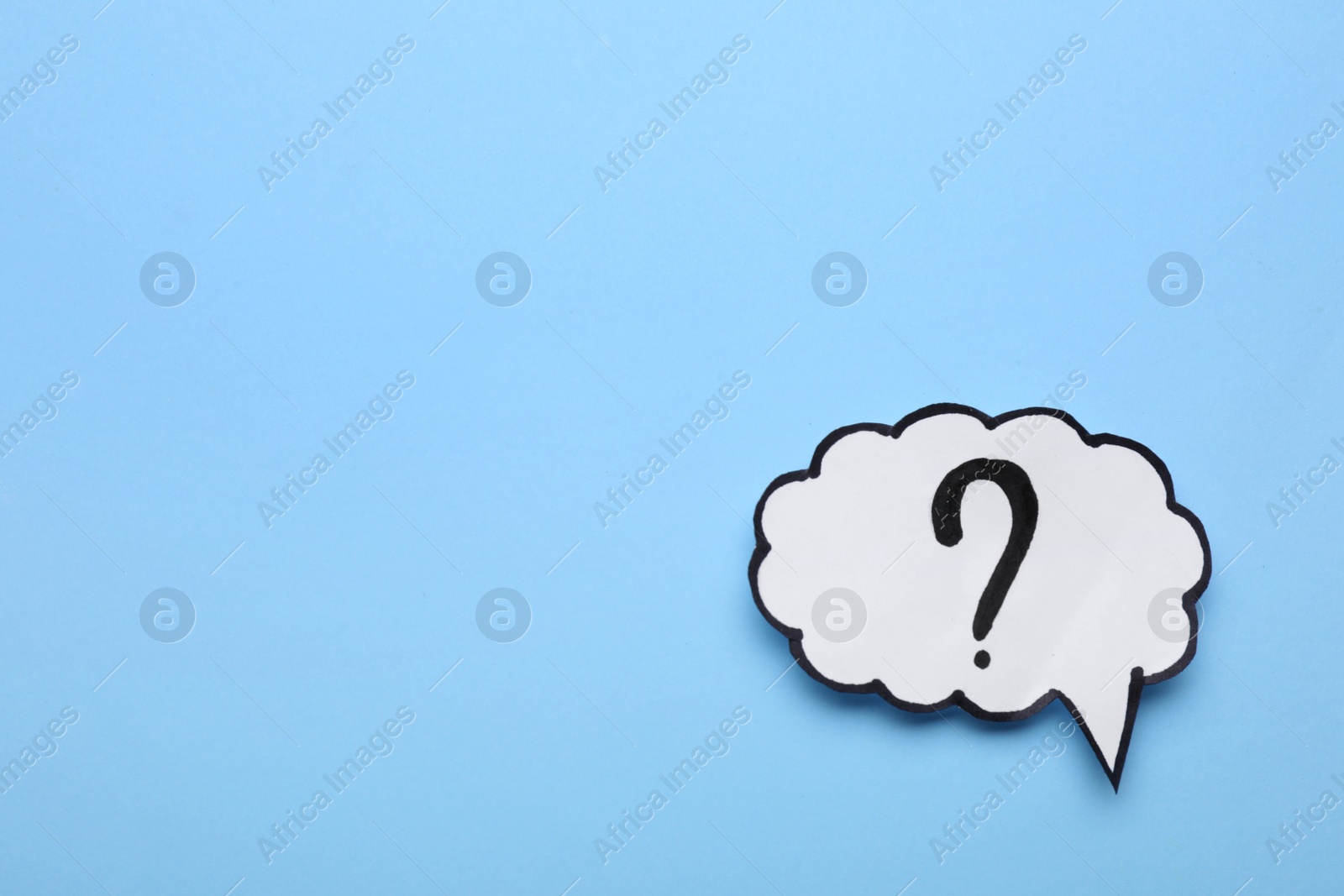 Photo of Paper speech bubble with question mark on light blue background, top view. Space for text