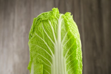 Photo of Fresh ripe Chinese cabbage against blurred background, closeup