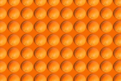 Image of Tasty fresh ripe oranges on orange background, flat lay