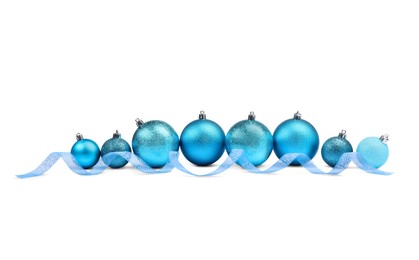 Photo of Beautiful Christmas balls and ribbon isolated on white