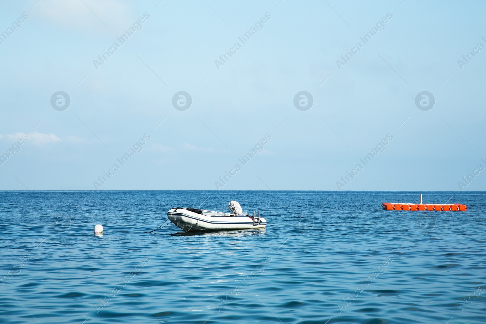 Photo of Inflatable boat on sea under blue sky