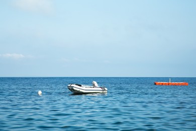 Photo of Inflatable boat on sea under blue sky