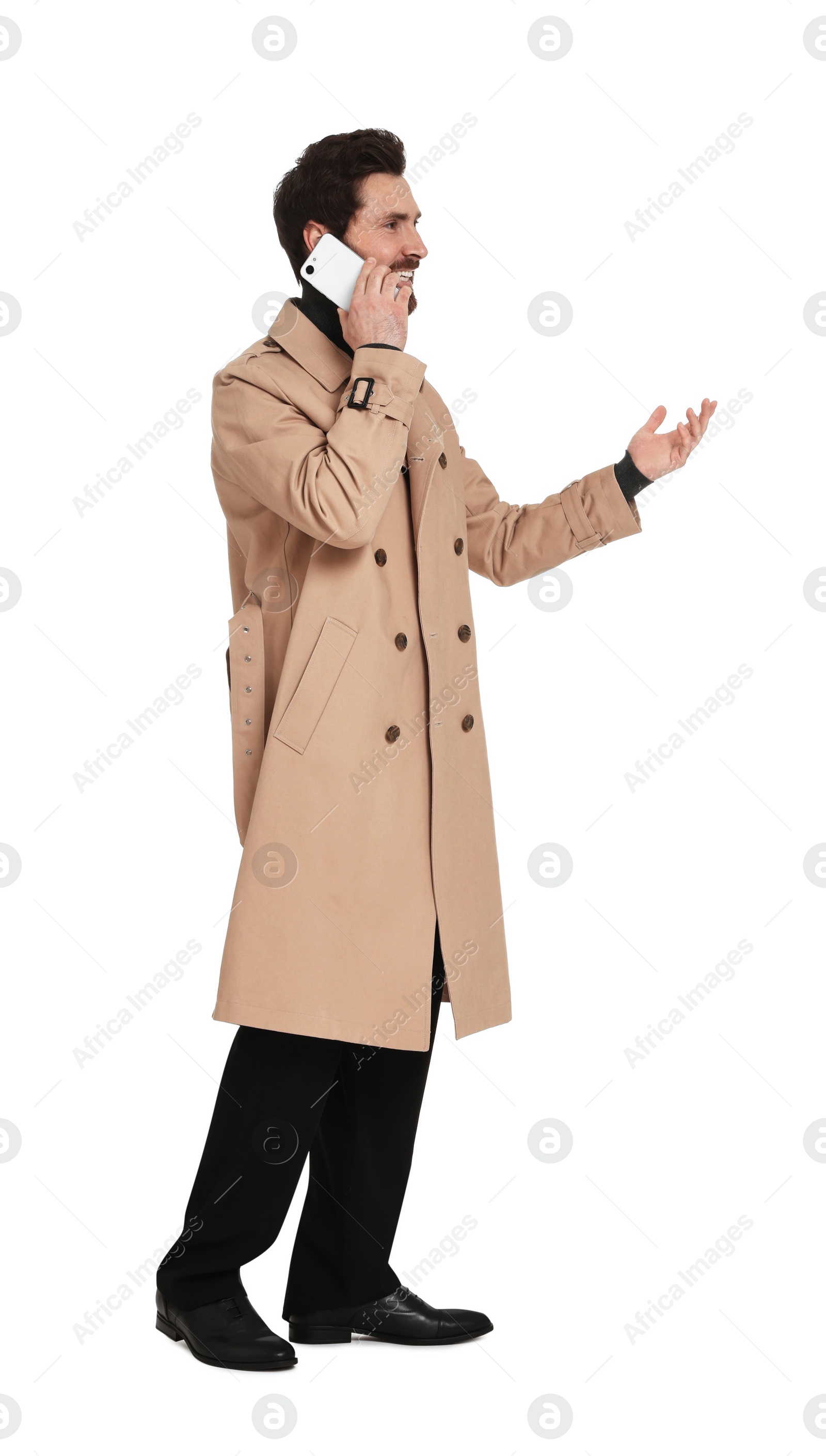 Photo of Handsome man talking on phone against white background