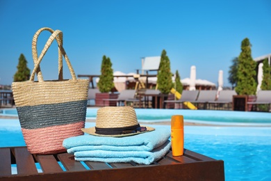 Photo of Beach accessories near swimming pool on sunny day