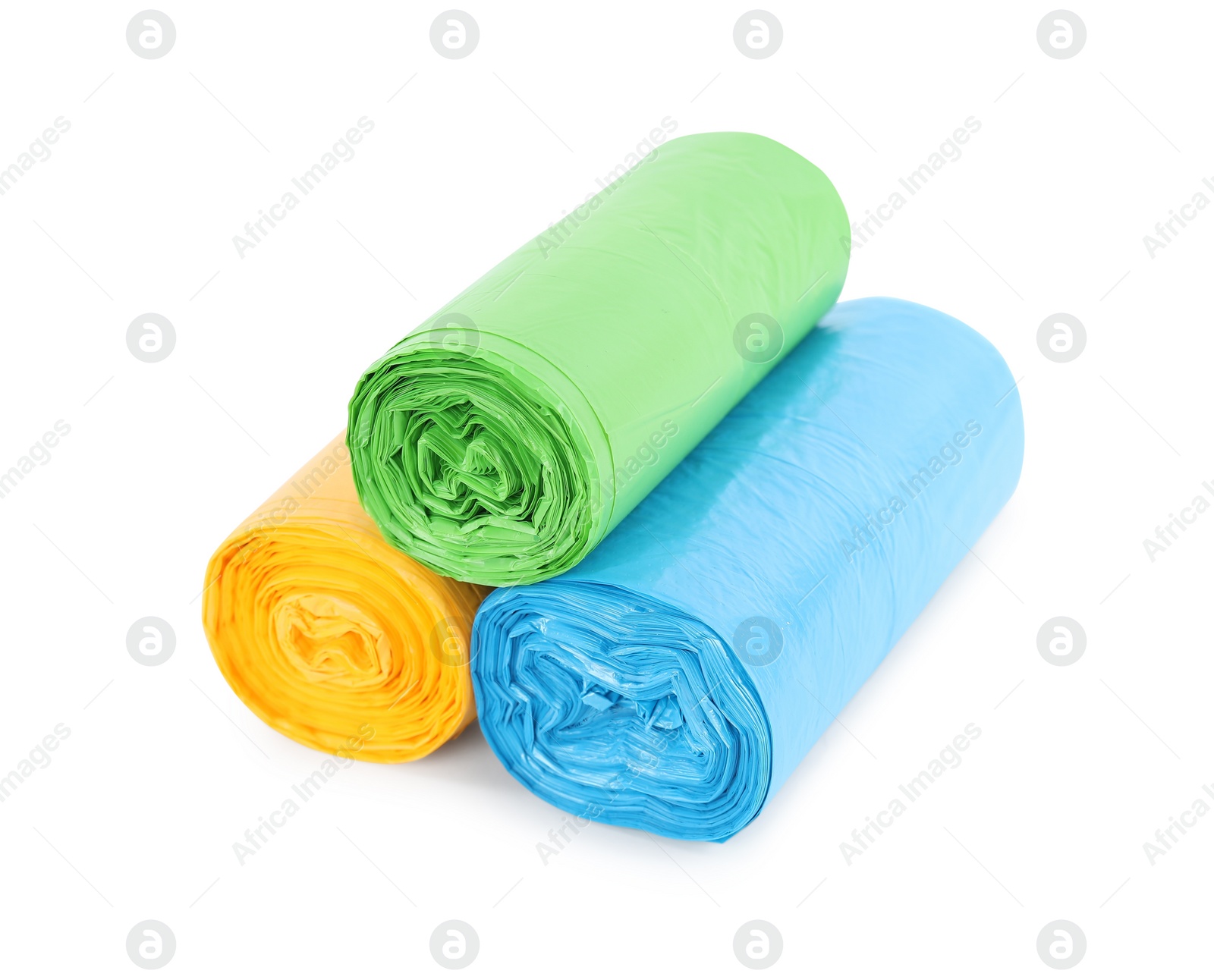 Photo of Rolls of colorful garbage bags isolated on white