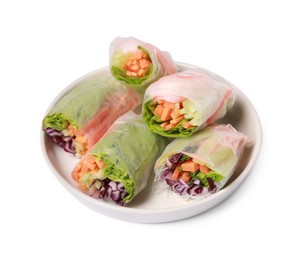 Photo of Plate of different delicious spring rolls wrapped in rice paper isolated on white