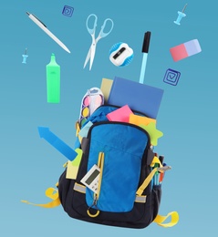 Image of School stationery and backpack falling on light blue background